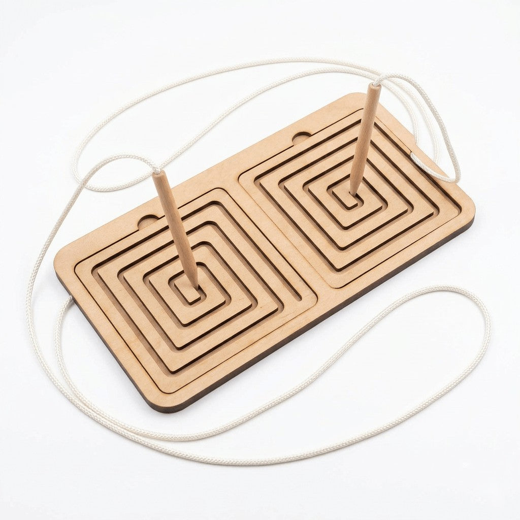 Ambidextrous pre-writing board with square spiral tracing cards and two wooden pointers resting in the grooves